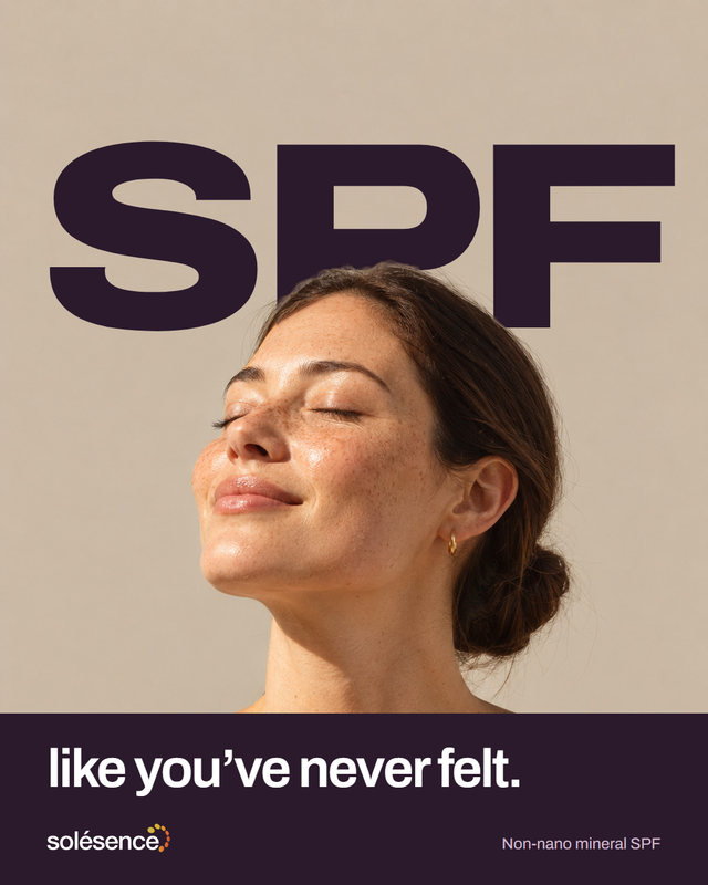 New concept post. A woman with freckles tilts her face up to warm light, eyes closed, smiling. Huge dark letters behind her head read SPF, and the band below finishes the line: like you've never felt. Non-nano mineral SPF.
